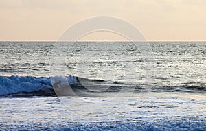 Surfer on Blue Ocean Wave in Bali