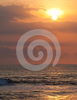 Surfer on Blue Ocean Wave in Bali