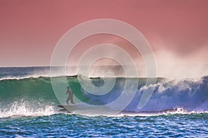 Surfer on Blue Ocean Wave in Bali