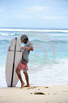 Surfer boy on the beach