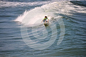 Surfer Boy Carving a Wave in the Outer Banks of NC