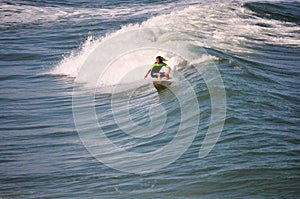 Surfer Boy Carving a Wave in the Outer Banks of NC photo