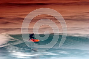 Surfer catching the wave