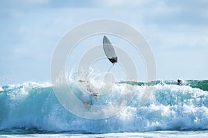 Surfer crashing in the wave in Montanita, Ecuador