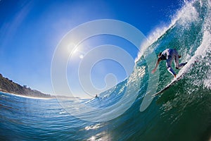 Surfer Dropping Down Wave