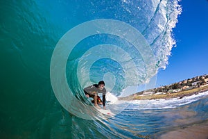 Surfer Rides Hollow Wave