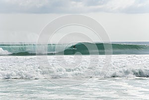 Surfer getting barrelled