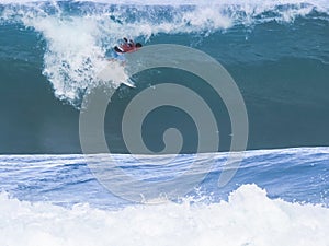 Surfer getting a tube ride at pipeline, hawaii