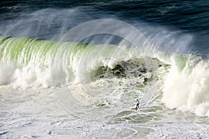 Surfer on Getxo challenge of huge waves