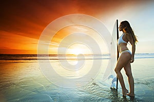 Surfer girl on the beach