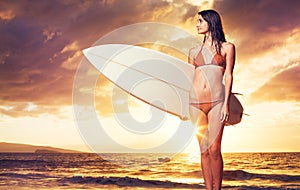 Surfer Girl on the Beach at Sunset