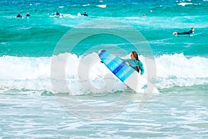 Surfer girl at Bondi Beach