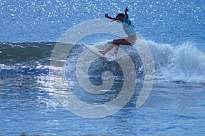 Surfer Girl Carving a Wave in the Outer Banks of NC