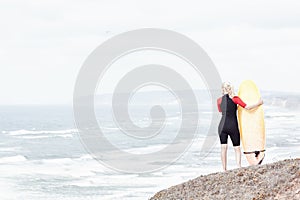 Surfer girl near ocean