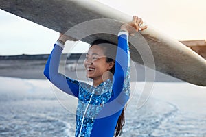 Surfer Girl. Surfing Woman Holding White Surfboard On Head. Smiling Brunette In Blue Wetsuit Going To Surf In Ocean.