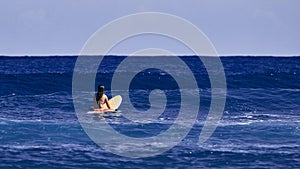 Surfer girl is waiting for a wave. Surfer school. Beautiful young woman Surfer on the wave. beautiful ocean wave. Water