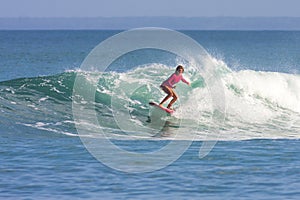 Surfer girl on the wave