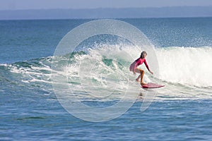 Surfer girl on the wave