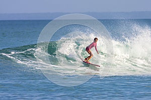 Surfer girl on the wave