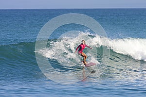 Surfer girl on the wave