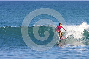 Surfer girl on the wave