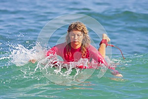 Surfer girl on the wave