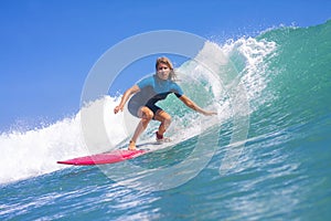 Surfer girl on the wave