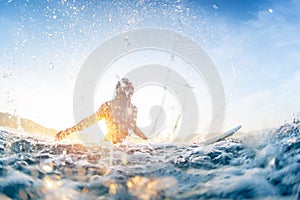 Surfer haves fun and makes water splashes