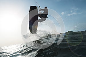 Surfer jumping a wave in front of the camera