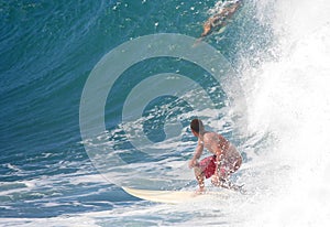 Surfer looking at big wave