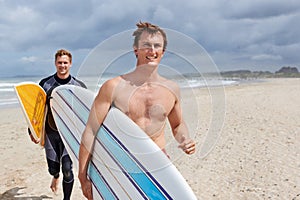 Surfer men, running and friends at beach with smile, training and fitness on vacation in summer. Exercise, people and