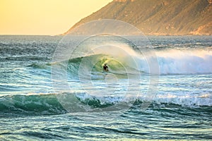 Surfer in Noordhoek Beach photo