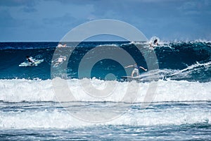 Surfer on perfect blue aquamarine wave, empty line up, perfect for surfing, clean water, Indian Ocean