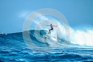 Surfer on perfect blue aquamarine wave, empty line up, perfect for surfing, clean water, Indian Ocean