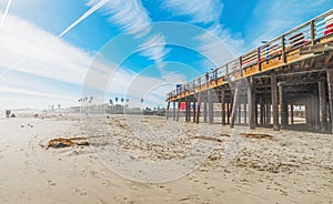 surfer by Pismo Beach pier