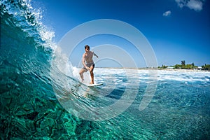 Surfer rides ocean wave