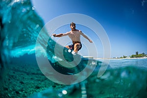 Surfer rides ocean wave
