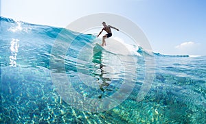 Surfer rides ocean wave