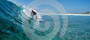 Surfer rides ocean wave