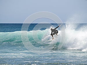 Surfer riding wave