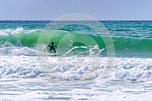 Surfer riding a wave in Lacanau, France