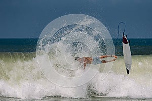 Surfer`s crash on the wave