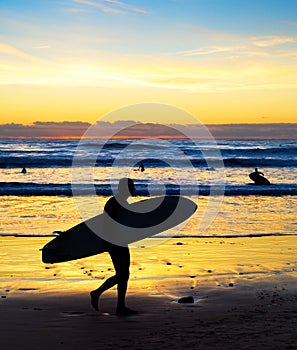 Surfer silhouette beach sunset Bali