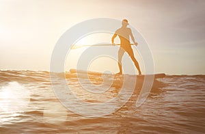 Surfer silhouette at sunset