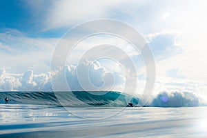 Surfer Riding a Barrel Wave
