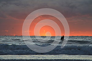 A Surfer at Sunrise