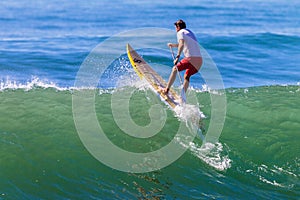 Surfer SUP Over Wave
