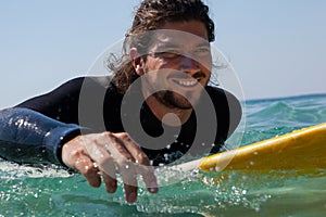 Surfer surfboarding in the sea