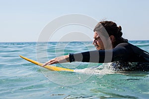 Surfer surfboarding in the sea