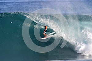 Surfer Surfing Backdoor Pipeline in Hawaii